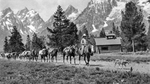 Pack train at String Lake, c. 1924. Photograph by Harrison Crandall