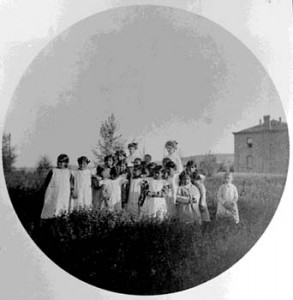 183. Shoshone girls and teacher outside Roberts Mission