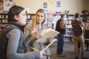 Carin Larkin, right, a Jackson Hole High School English teacher, goes over a student’s presentation with Rebecca Sgouros, of the Jackson Hole Historical Society and Museum.